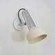 Adjustable wall spotlight in chrome-plated and white lacquered metal. 1970s