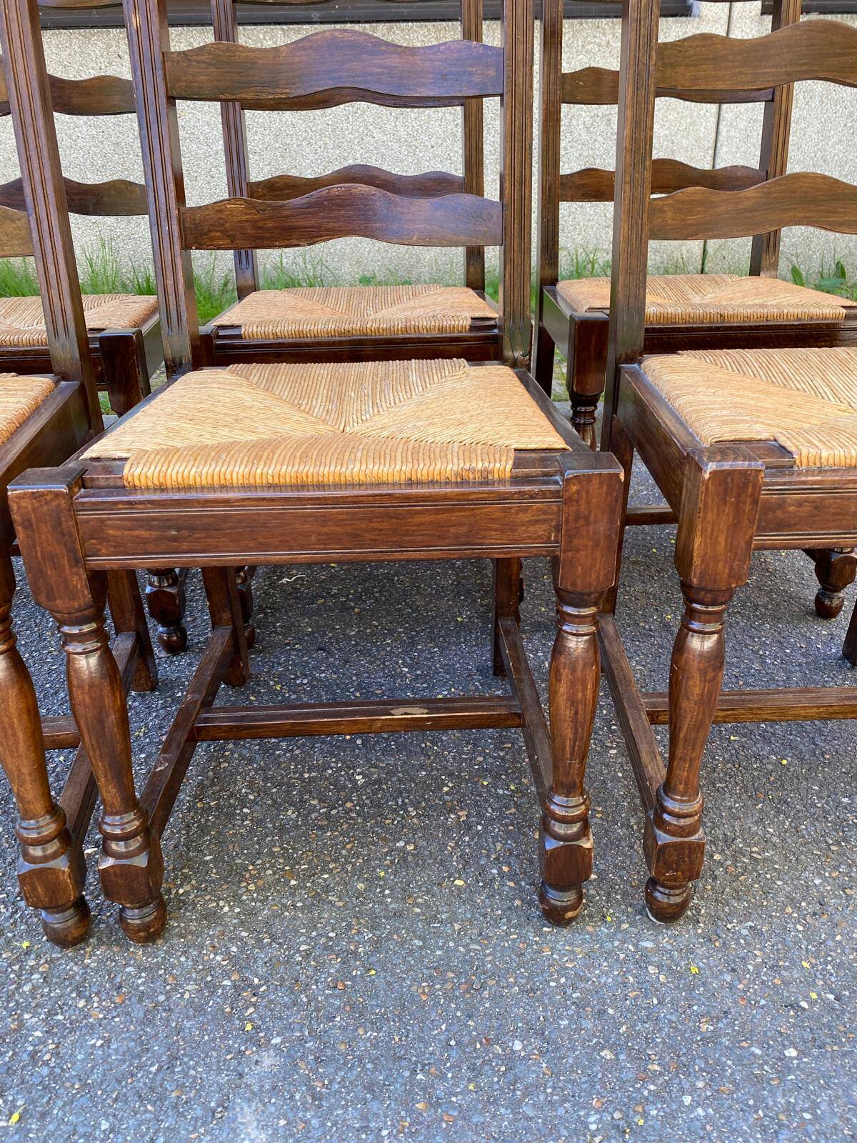 6 solid wood chairs in dark oak with a glossy finish and straw.