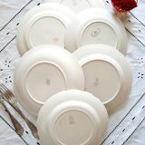 Flat earthenware plates with gilded edges