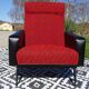 Vintage armchairs in red and black faux leather, the pair.