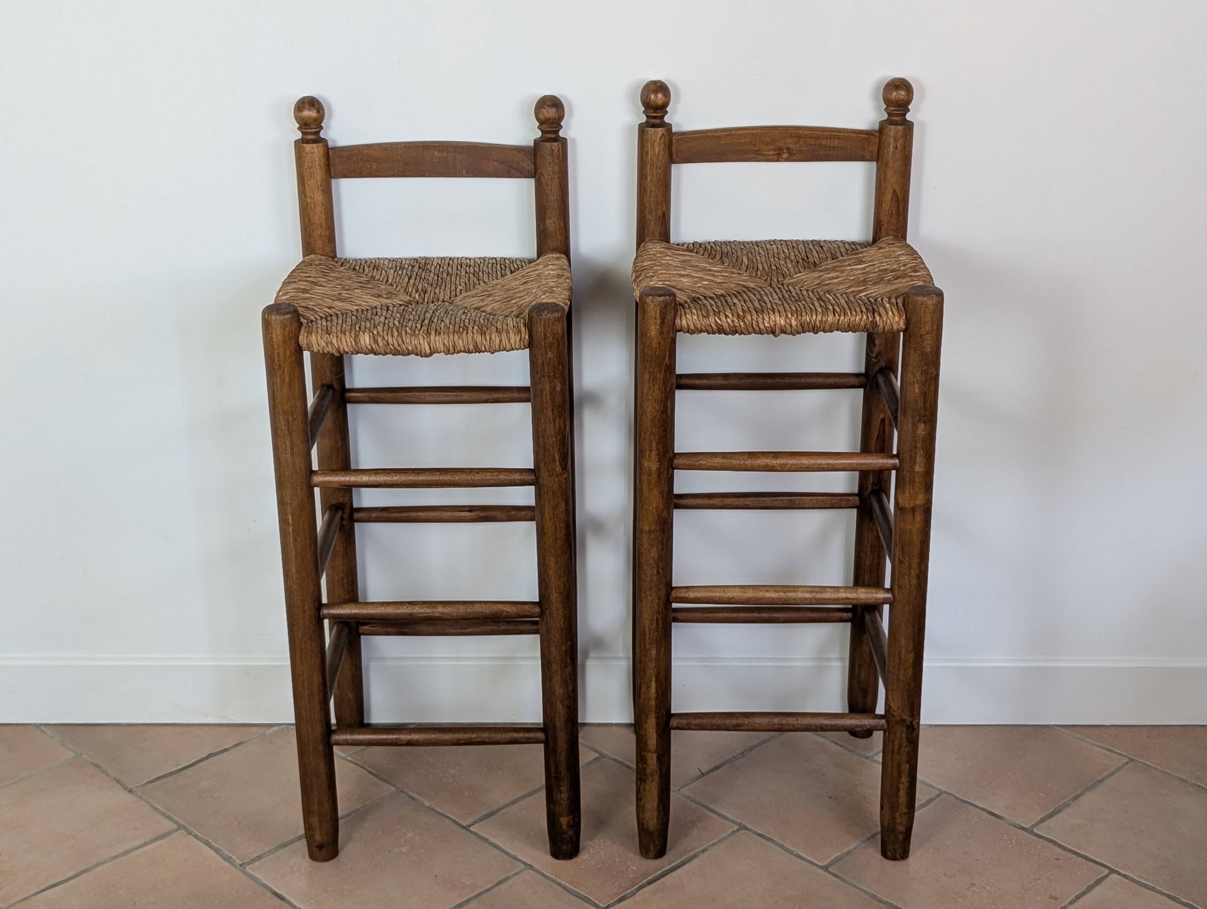 High wooden and straw stools