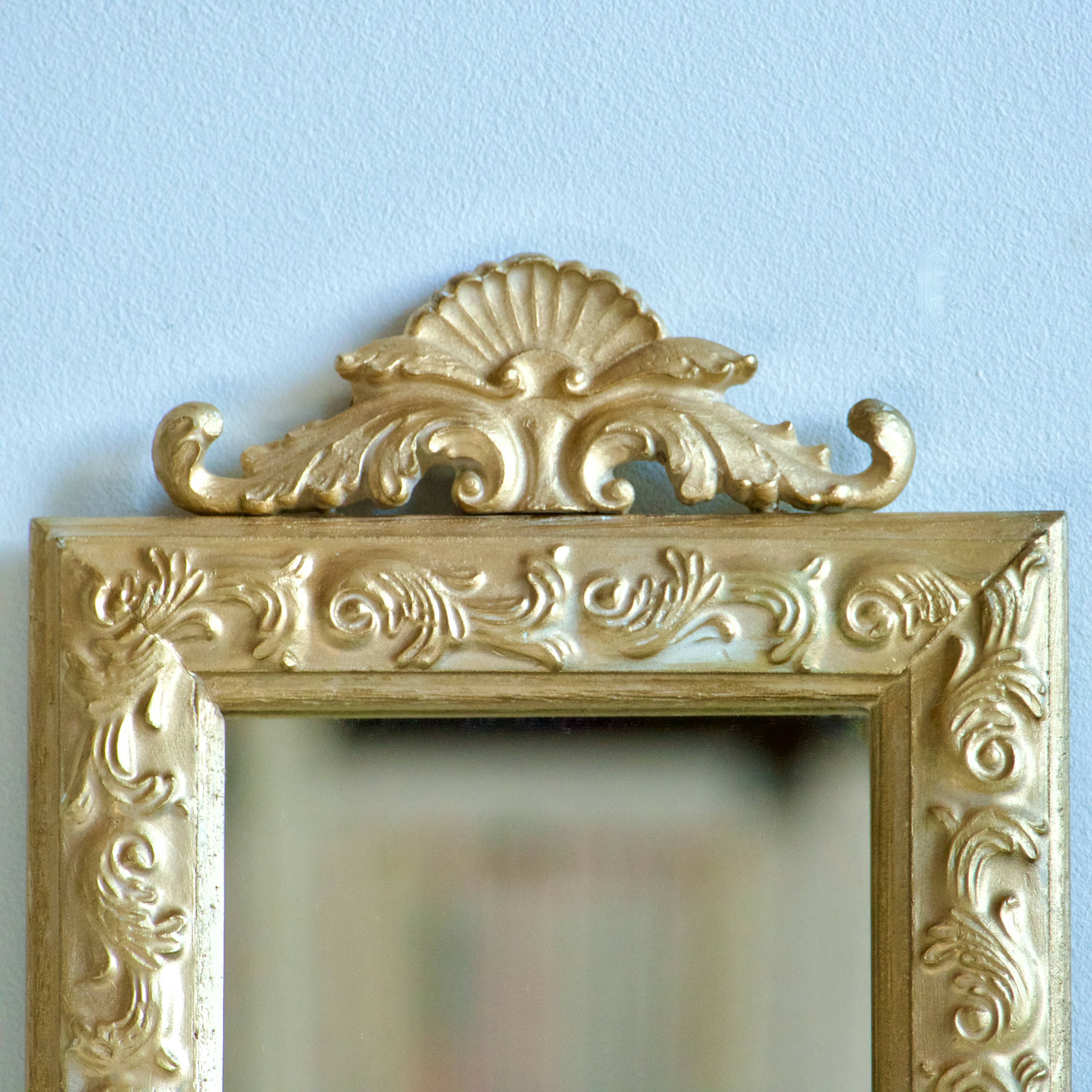 Antique gilded shell mirror with arabesque moldings