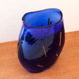 Blue blown glass vase and orange inclusion