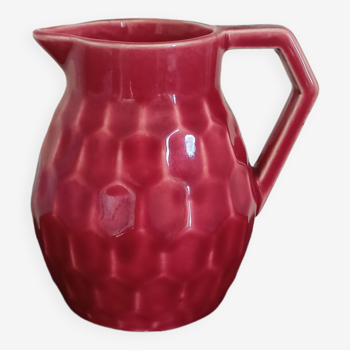 Small pitcher in old red earthenware