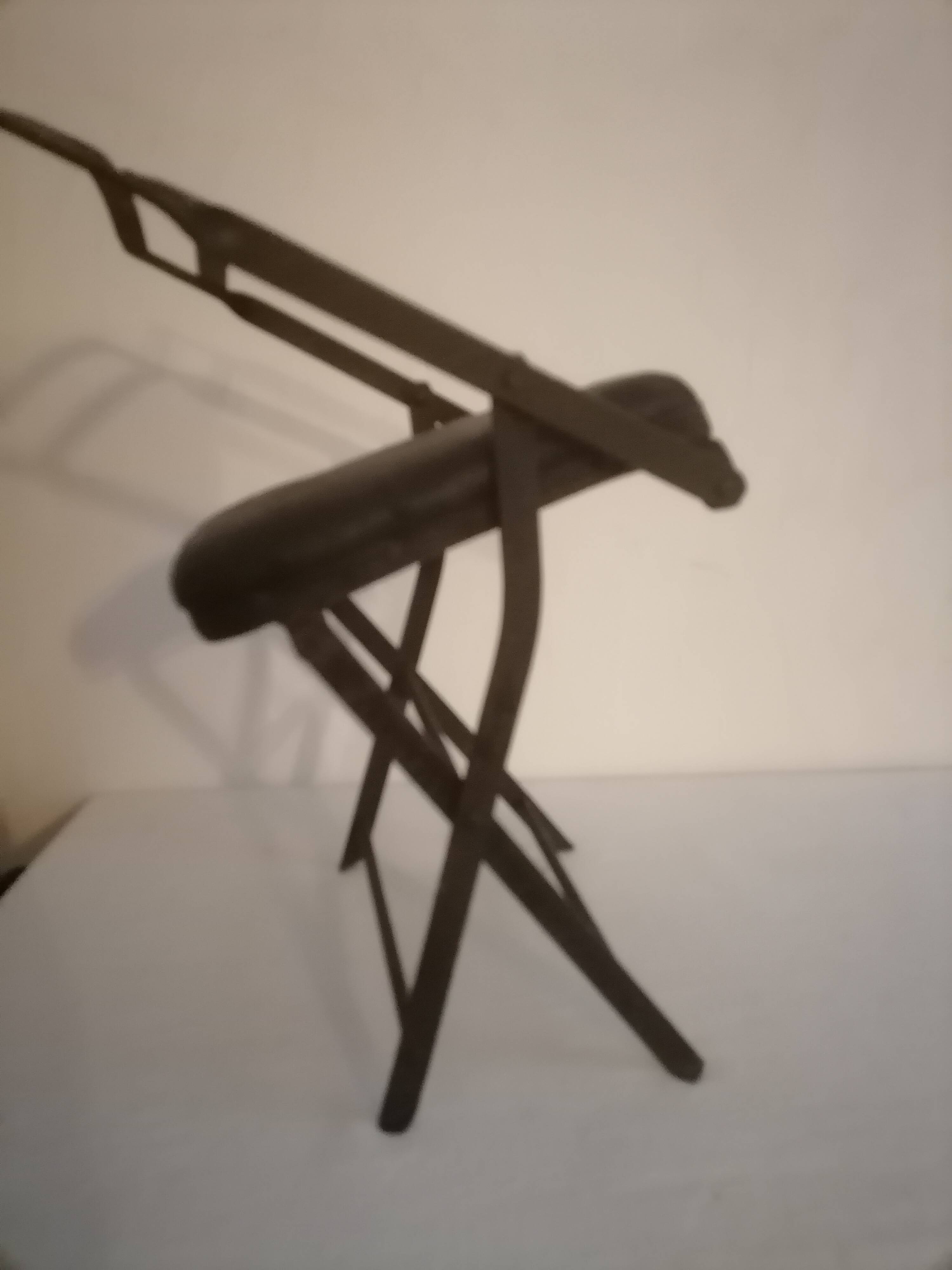 Old wrought iron folding children's chair. Early 20th century.
