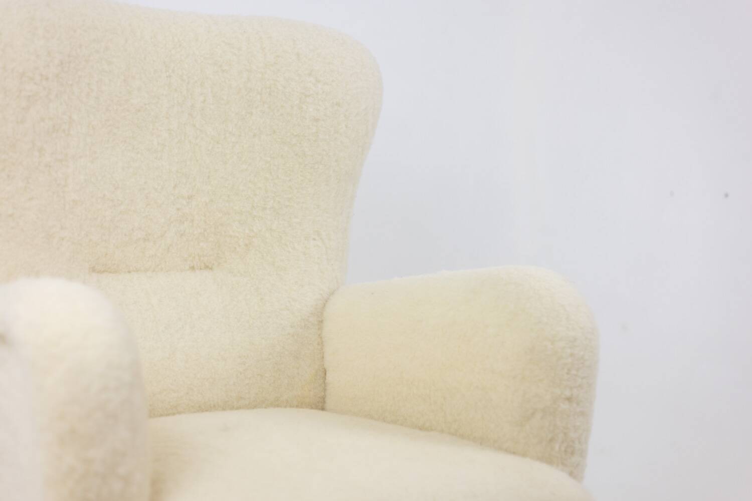 Armchair, or bergère, with its boucle fabric. 1950s