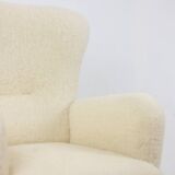 Armchair, or bergère, with its boucle fabric. 1950s