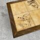 Vintage 70s coffee table with wood and ceramic tiles featuring bird and nature patterns.