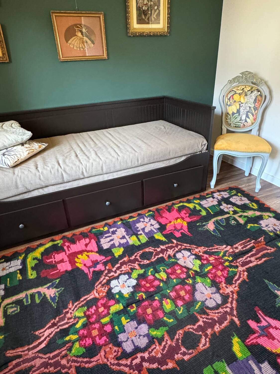 Bohemian floral design, handwoven wool rug, black background with colorful flowers