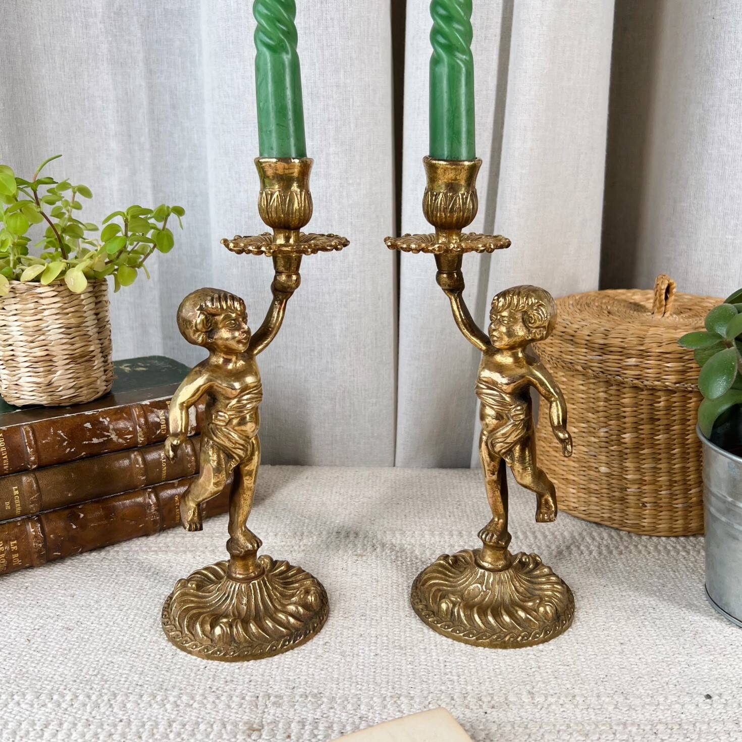 Pair of bronze “Cherubim” candlesticks