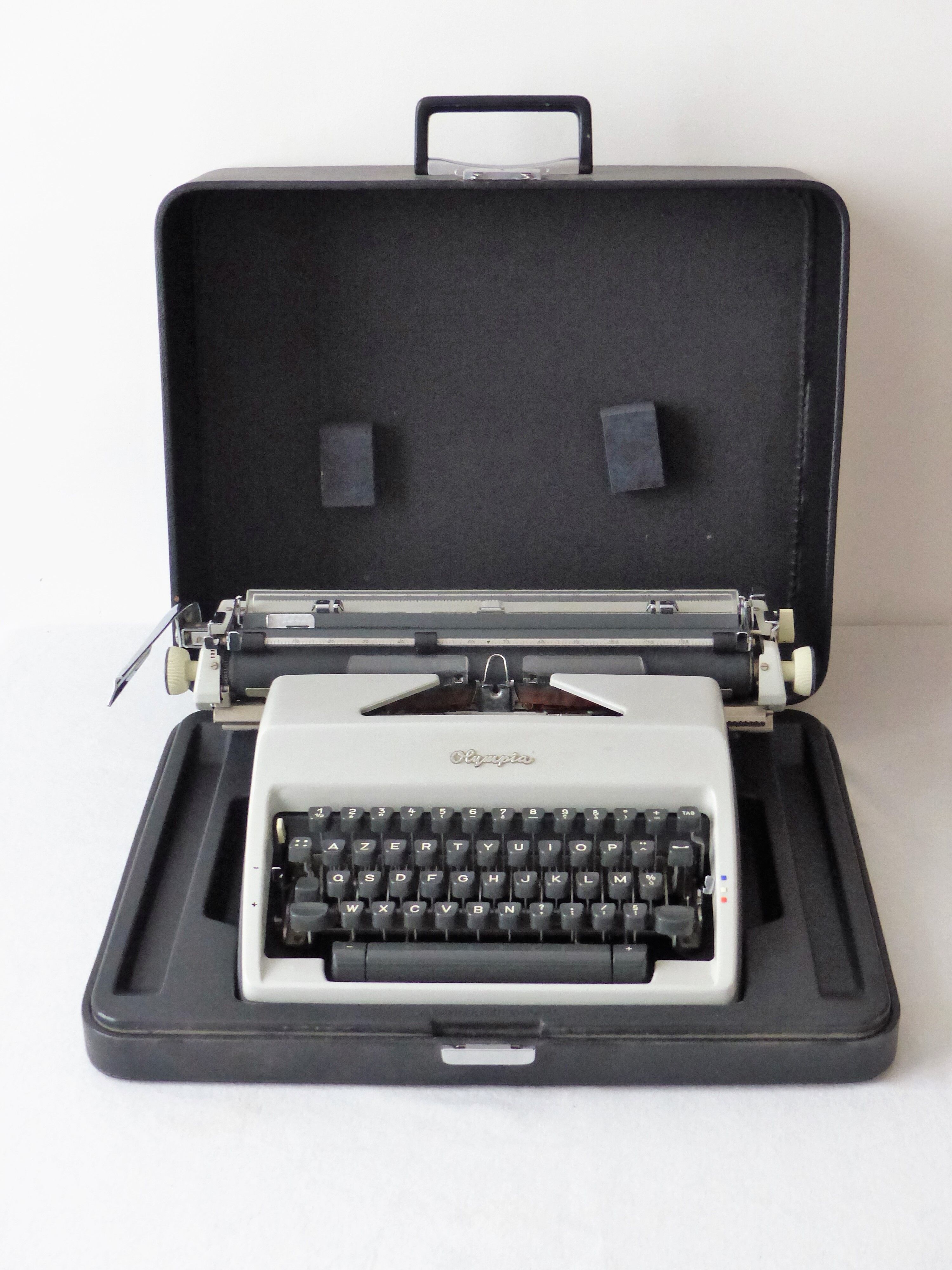 Olympia typewriter in his suitcase