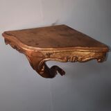 Corner console in gilded wood
