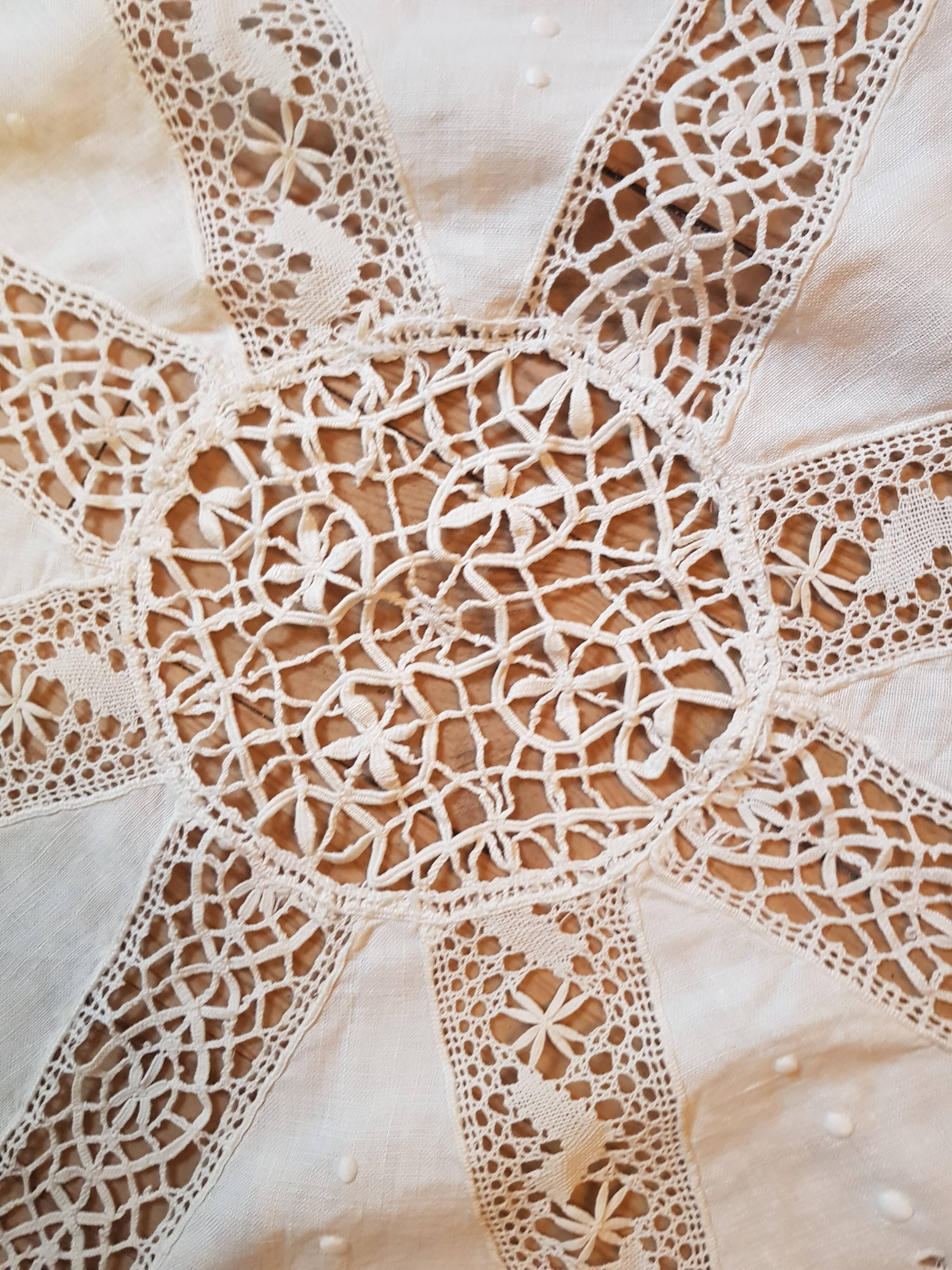Round hand-embroidered linen tablecloth