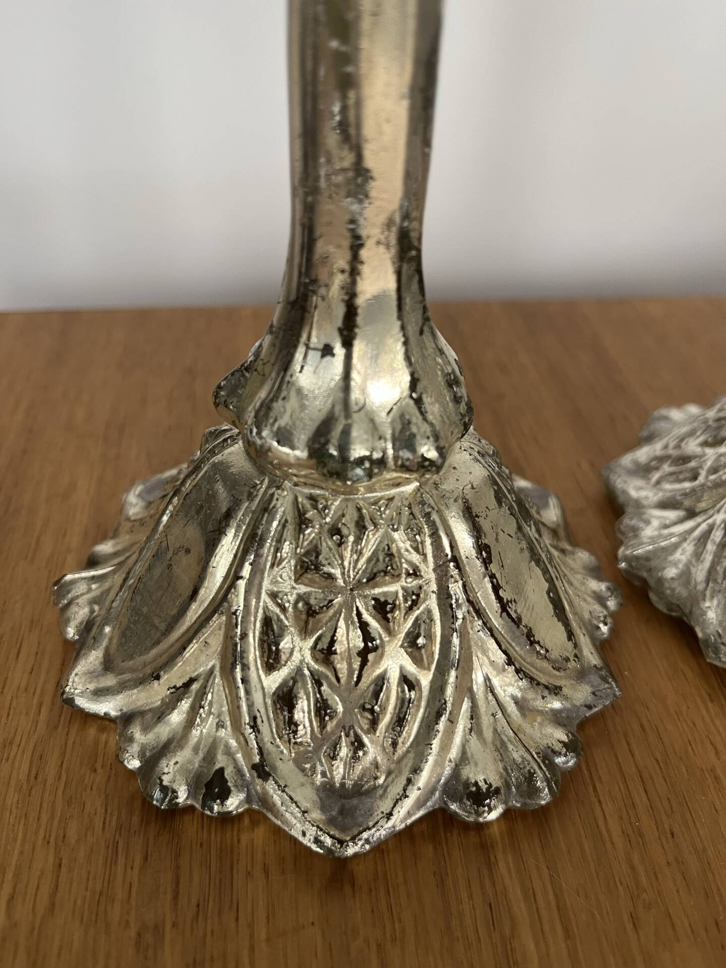 Pair of pressed glass candlesticks with silver plating.