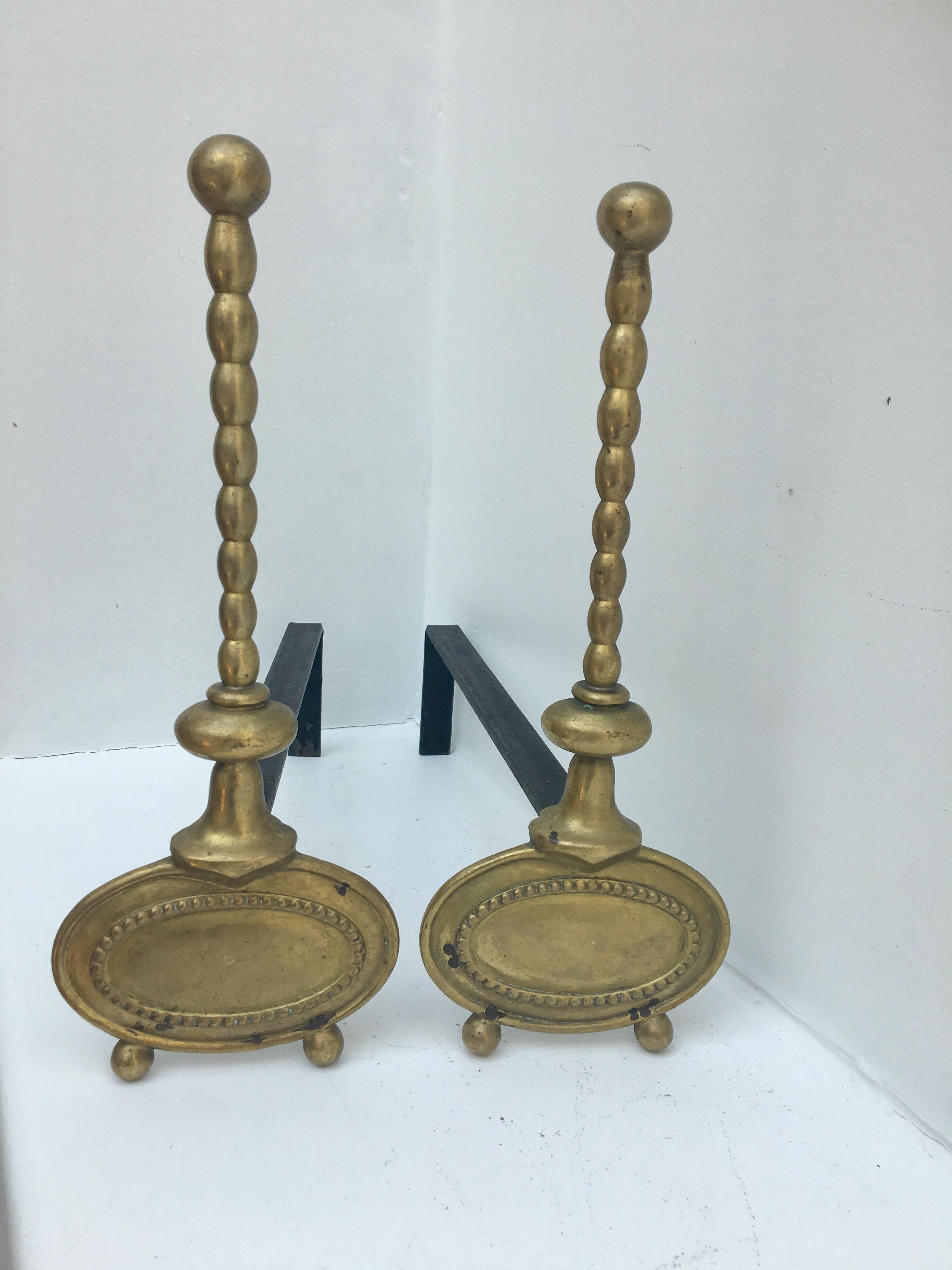 Pair of andirons in brass for fireplace