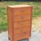 Vintage 1950s chest of drawers with tapered legs and 5 drawers.