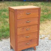 Vintage 1950s chest of drawers with tapered legs and 5 drawers.