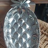 Silver-plated metal tray in the shape of a pineapple.