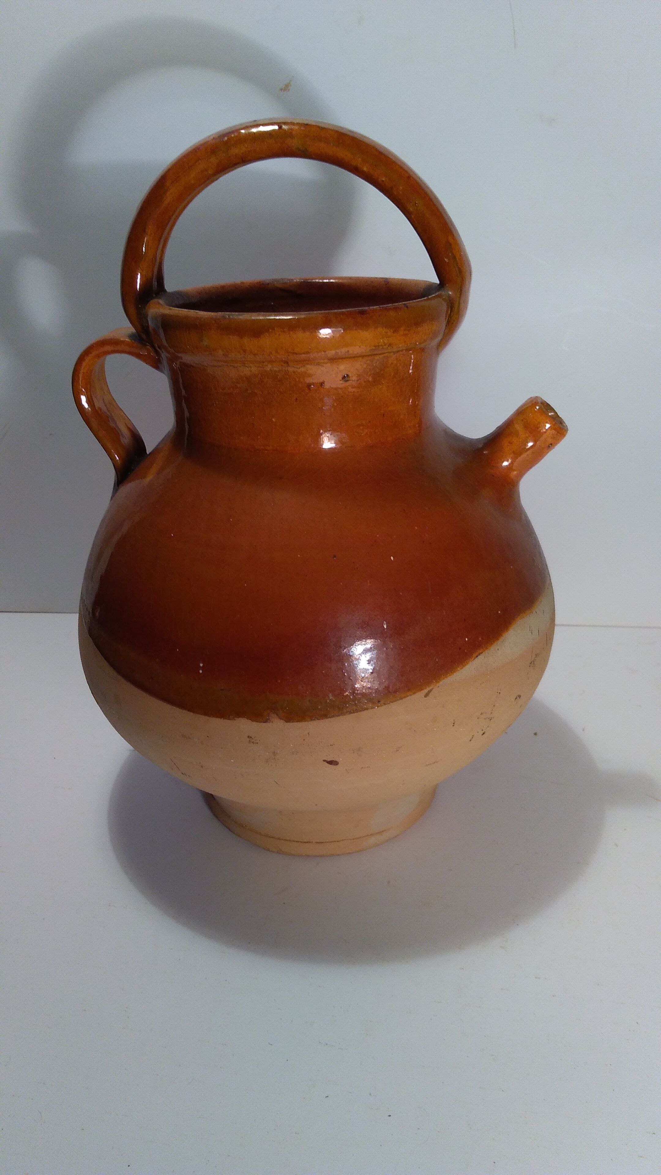 Old glazed earth jug