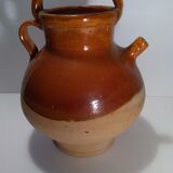 Old glazed earth jug