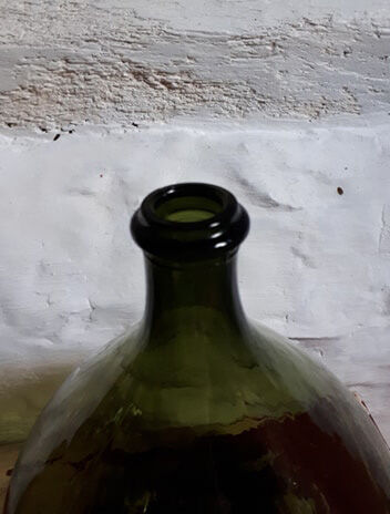 Dark green demijohn
