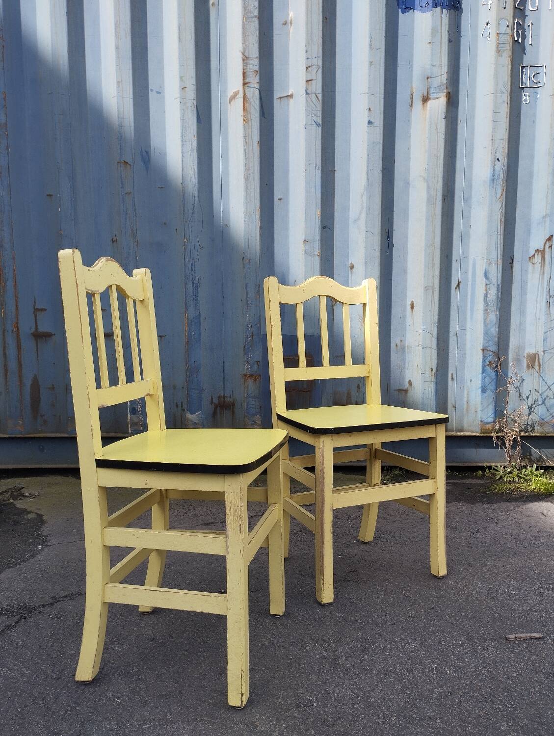 Pair of wooden and yellow formica chairs