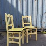 Pair of wooden and yellow formica chairs