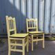 Pair of wooden and yellow formica chairs