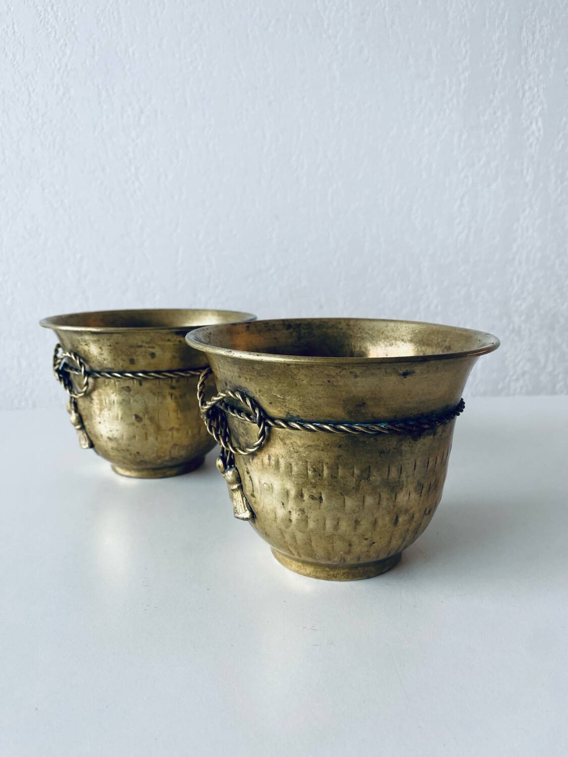 Pair of brass cord pot covers