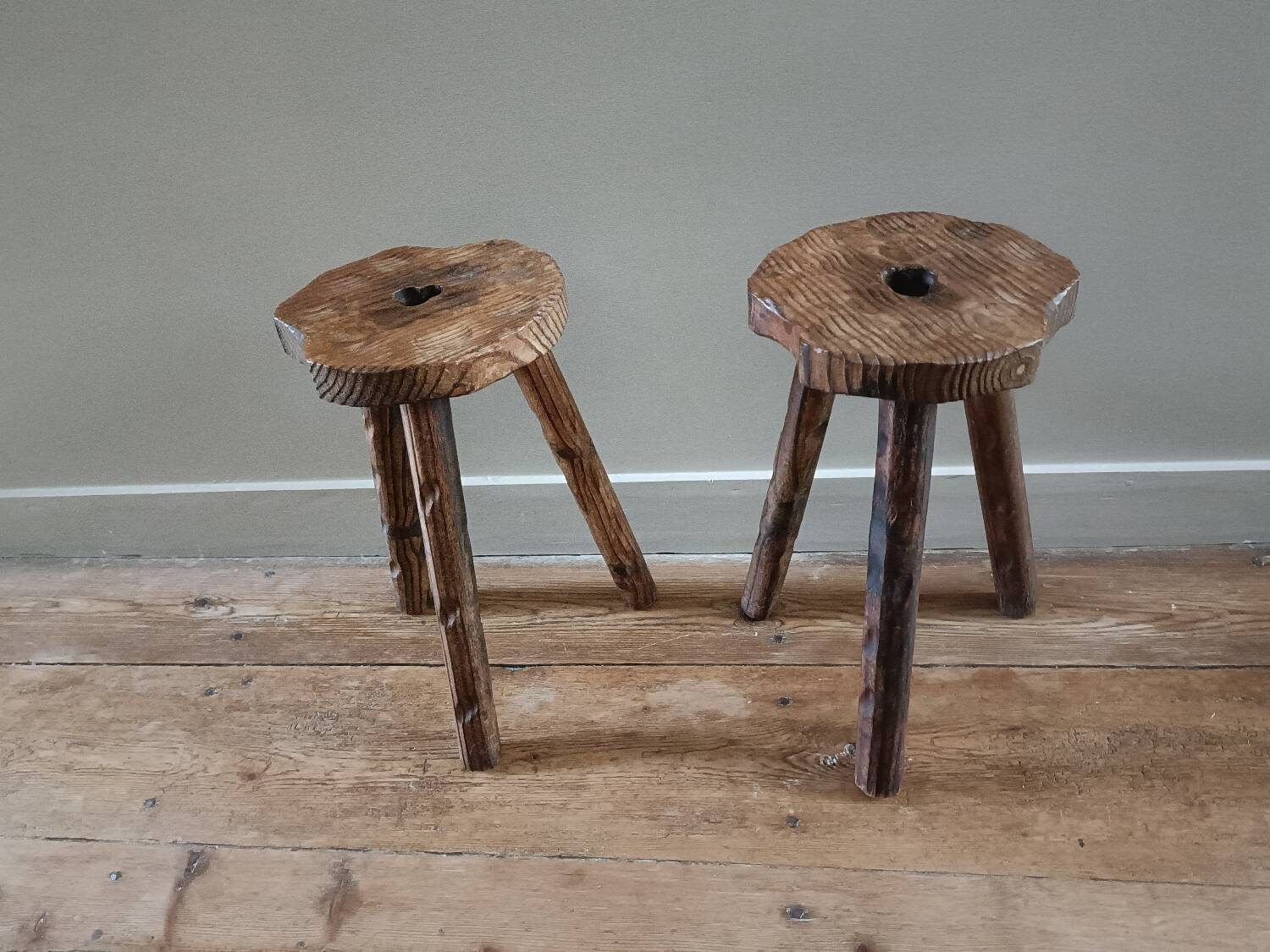A pair of tripod stools