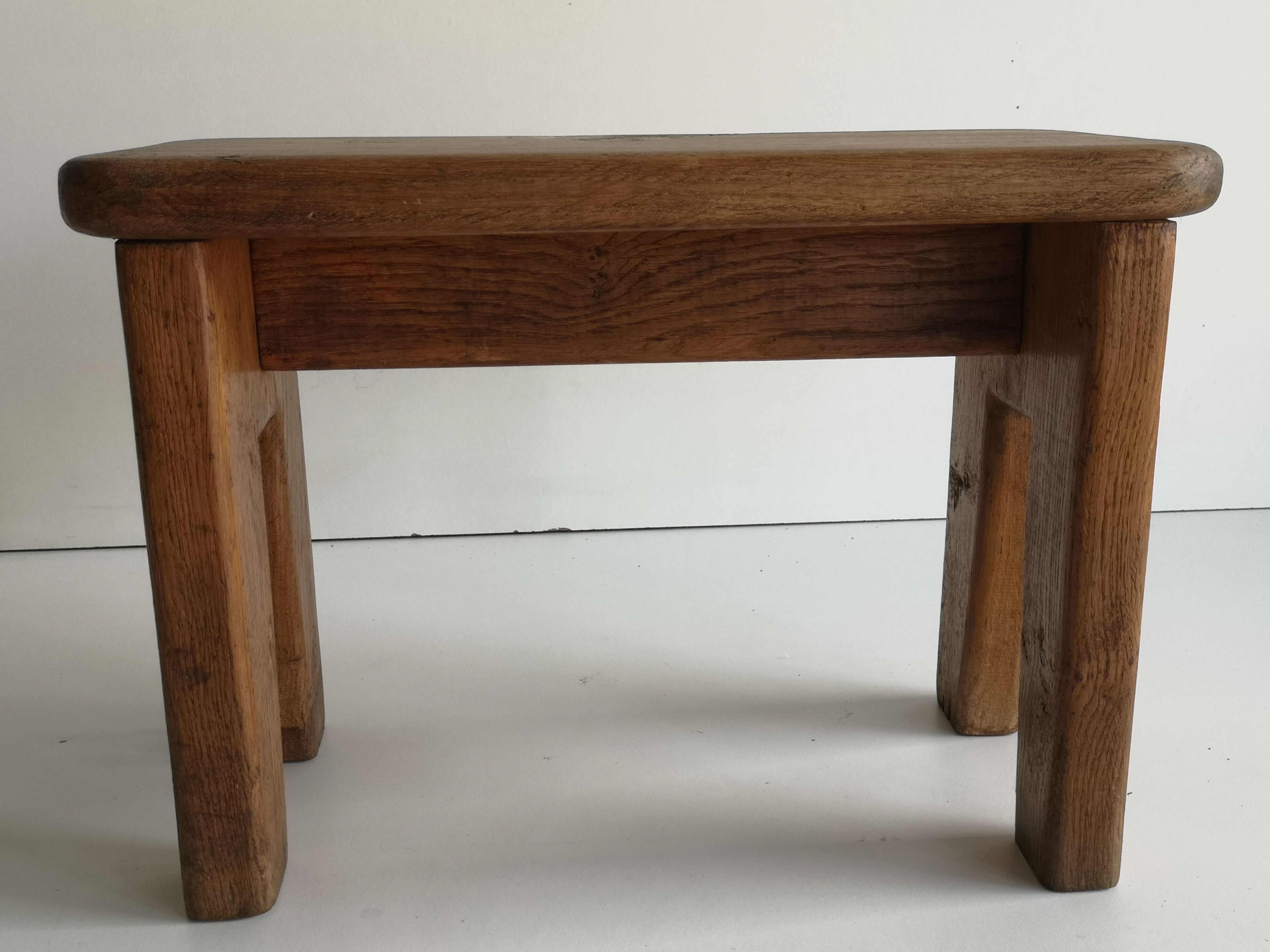 Small low stool in solid oak