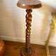 Antique pedestal table with a twisted column.