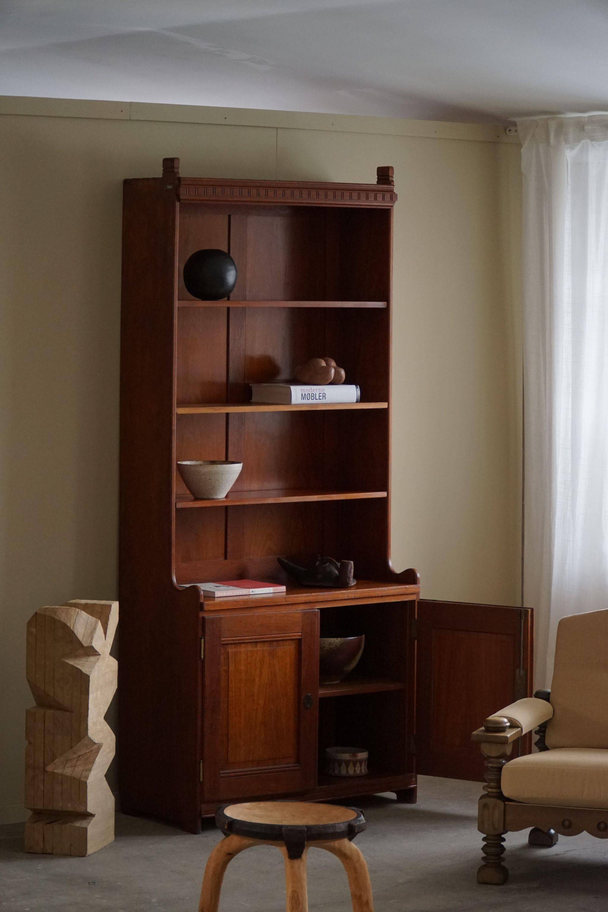 Rare high cabinet in teak by Martin Nyrop for Rud. Rasmussen, Denmark, early 20th century.