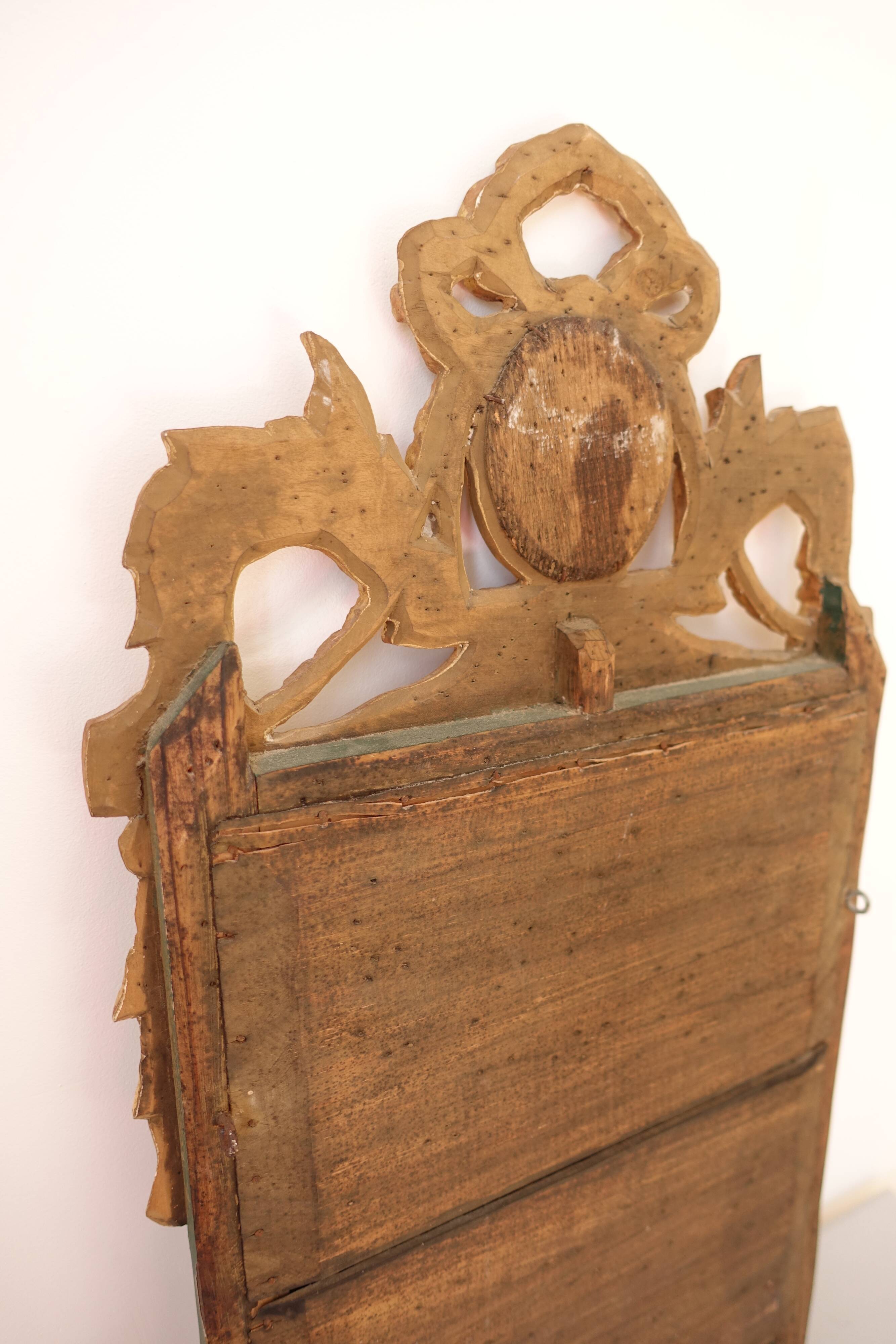 Miroir Louis XVI en bois doré 35x 65cm
