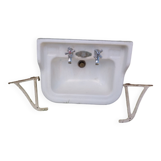 Washbasin with fixings and taps