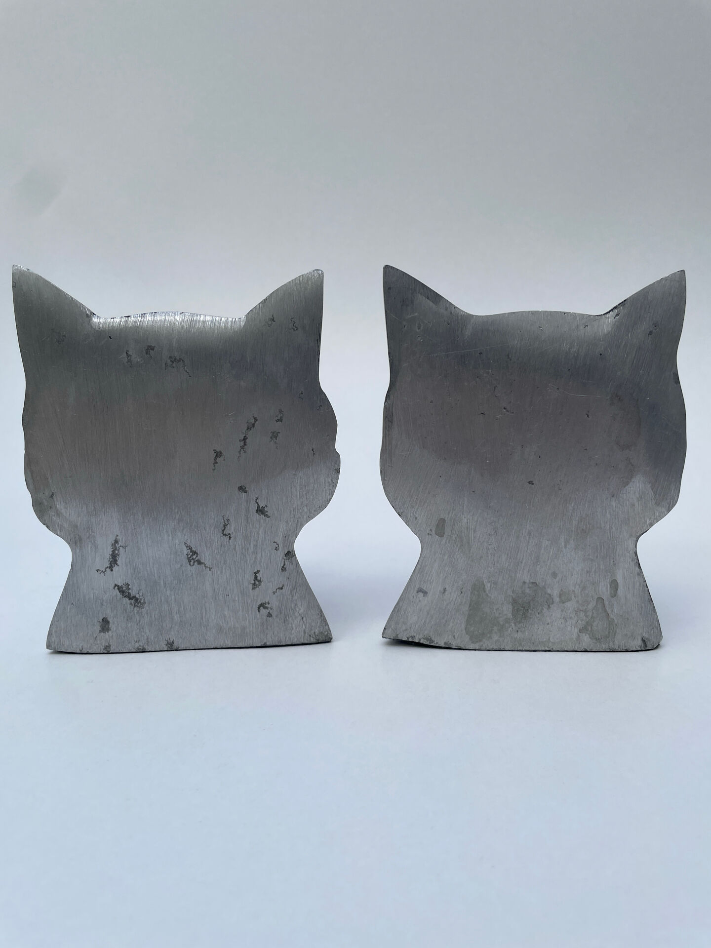 Pair of designer cat head bookends