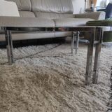 Round coffee table in smoked glass with chrome legs