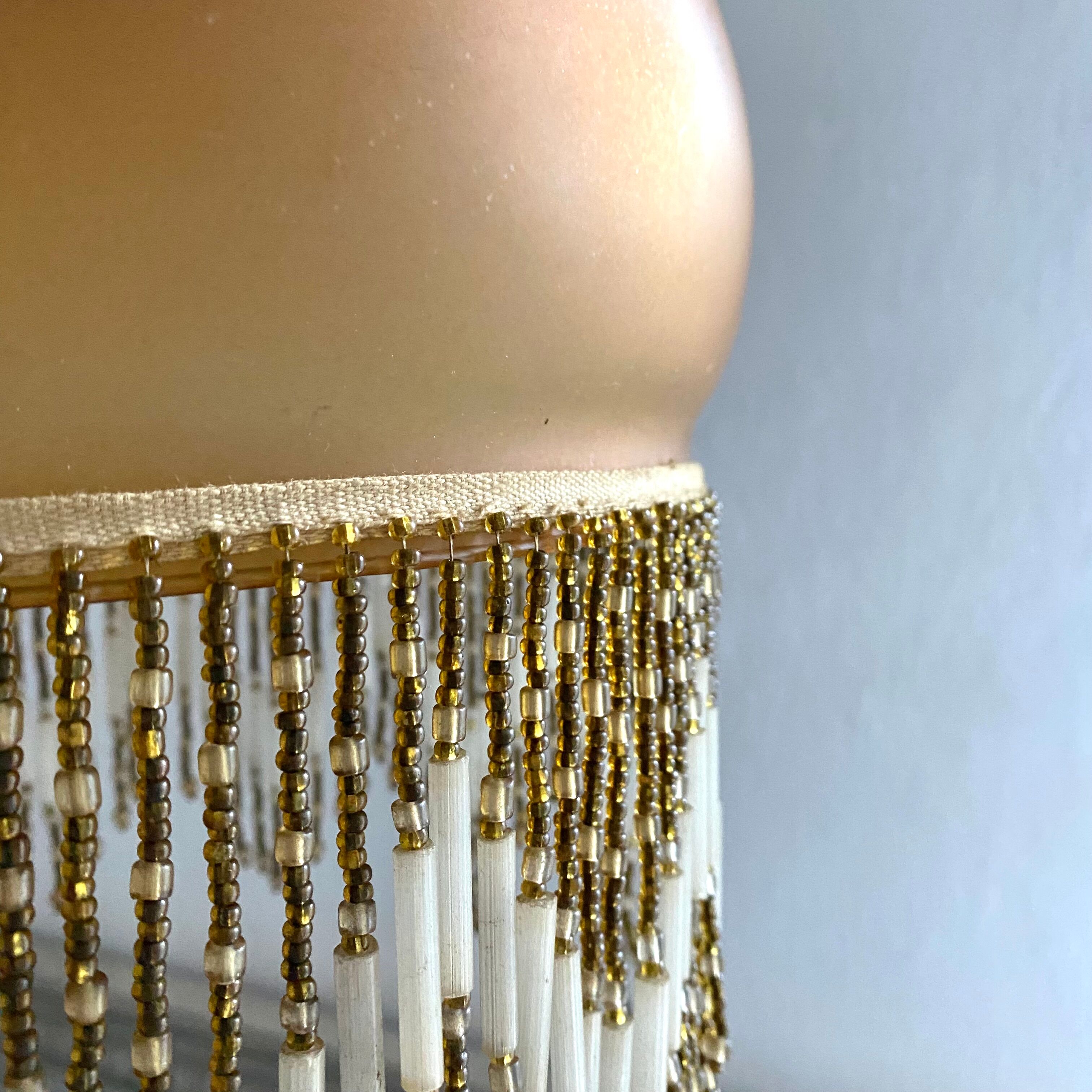 Amber polished glass and pearl suspension