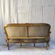 Three-seater canapé in carved wood, upholstery and gilded wood. Around 1900, Louis XV style.