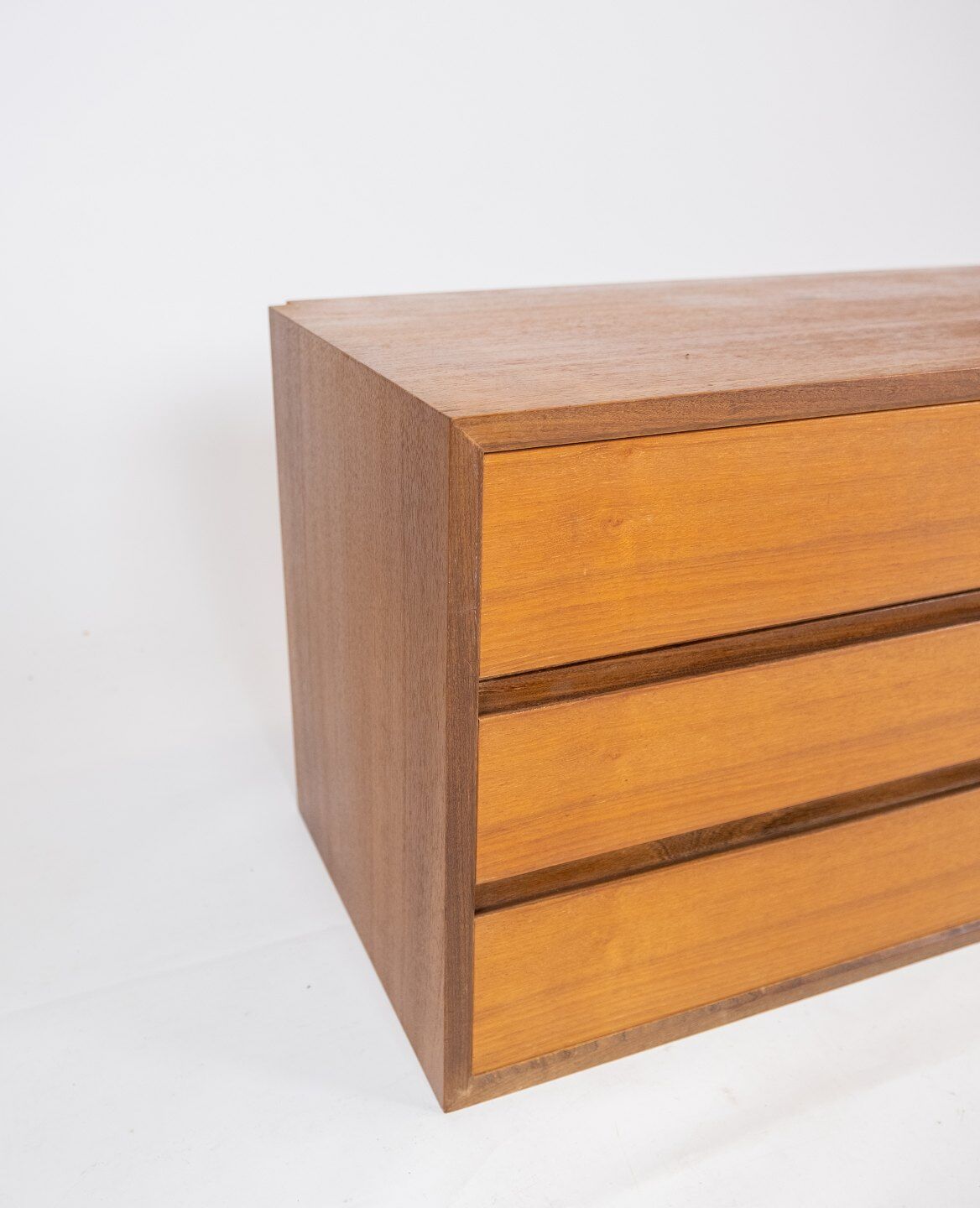 Wall mounted cabinet in teak of danish design from the 1960s.