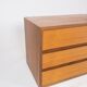 Wall mounted cabinet in teak of danish design from the 1960s.