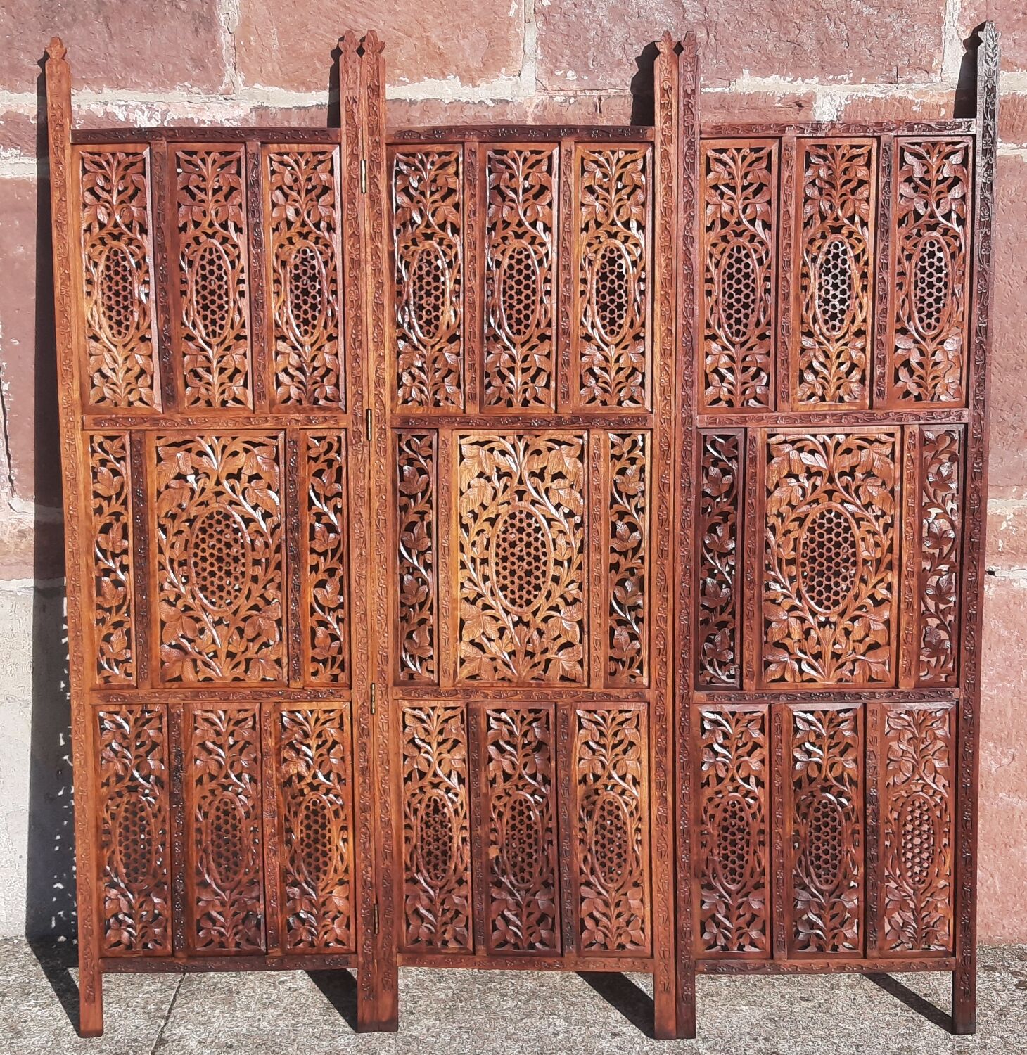Carved solid wood screen.