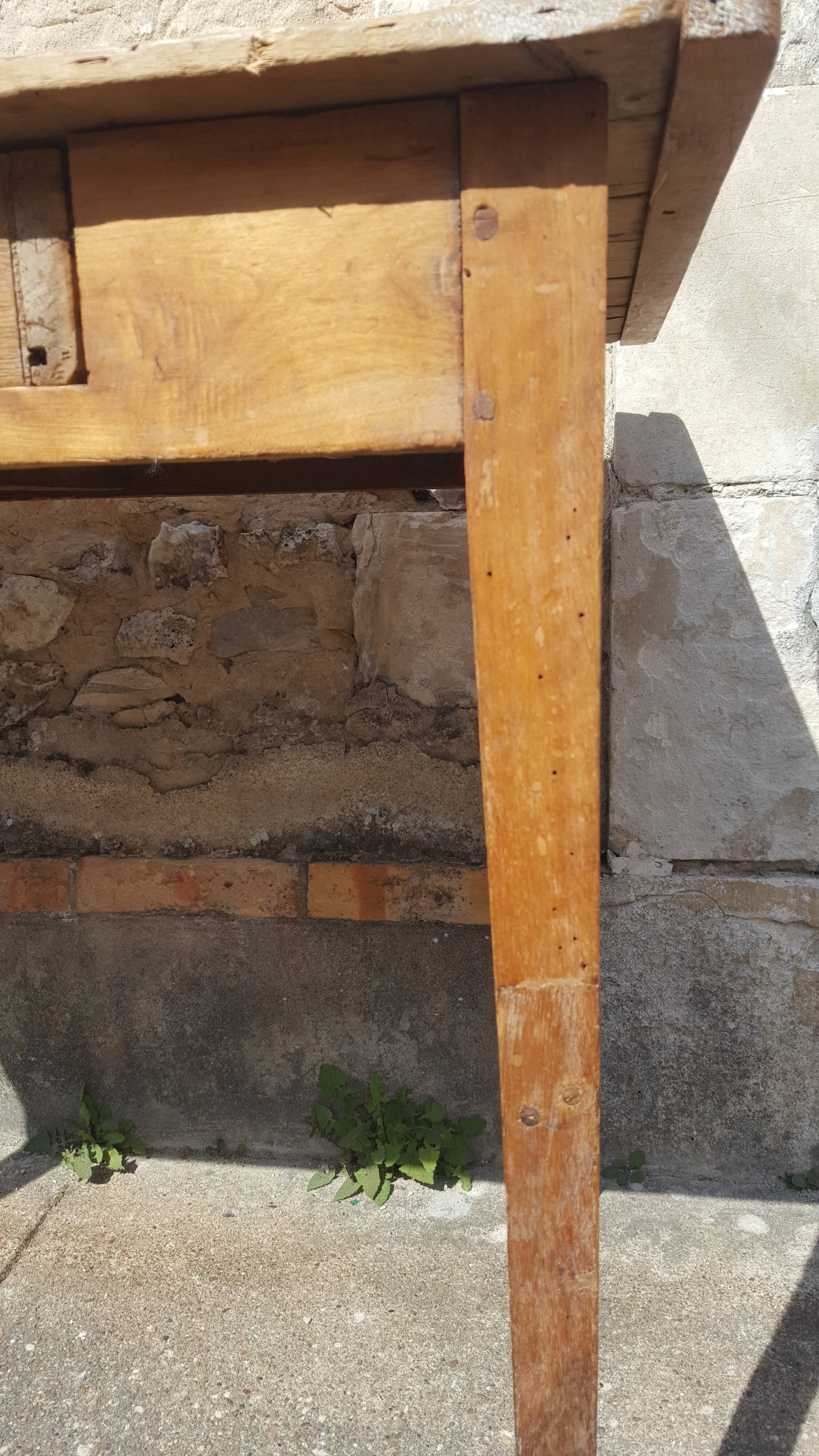 Raw wood farm table with drawer