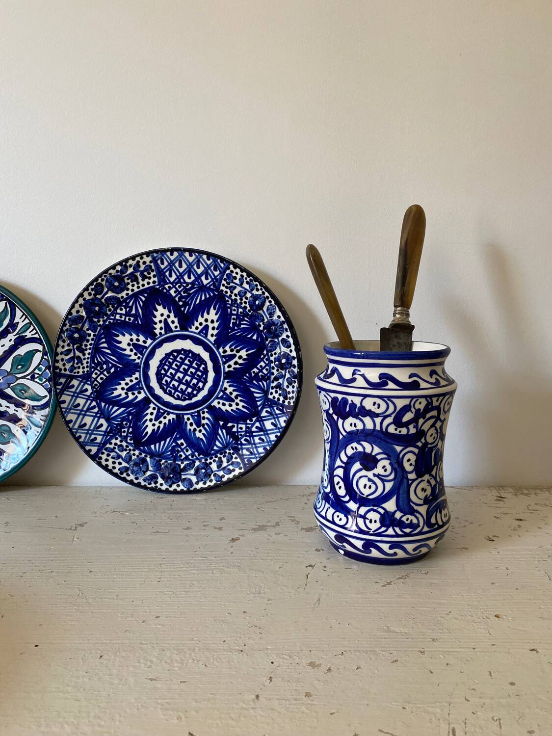 Small amphora vase in old hand-painted ceramic