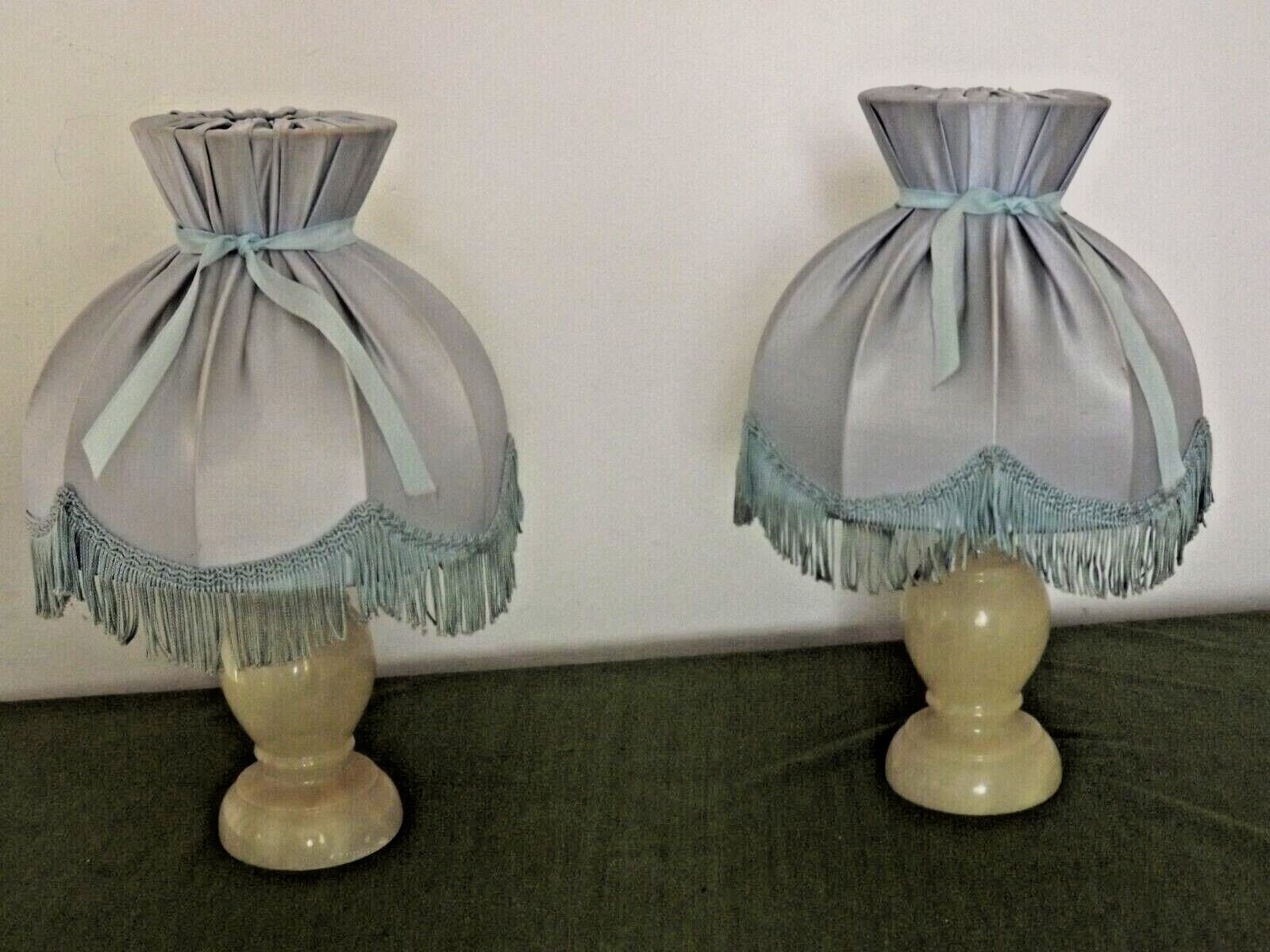 Pair of marble bedside lamps with blue satin fringed shades