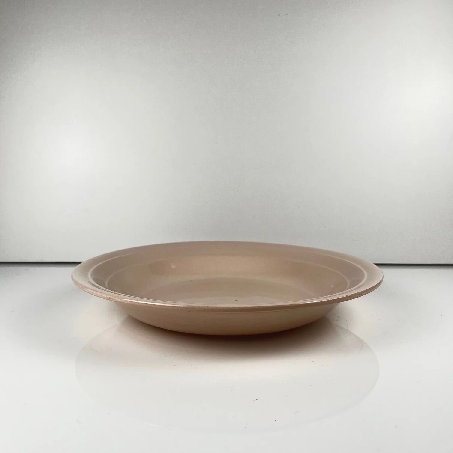 Pale pink hollow round plate St Amand, Céranor, 1940