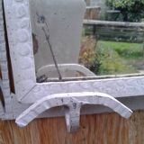 Former Wall coat hangers painted in gray iron