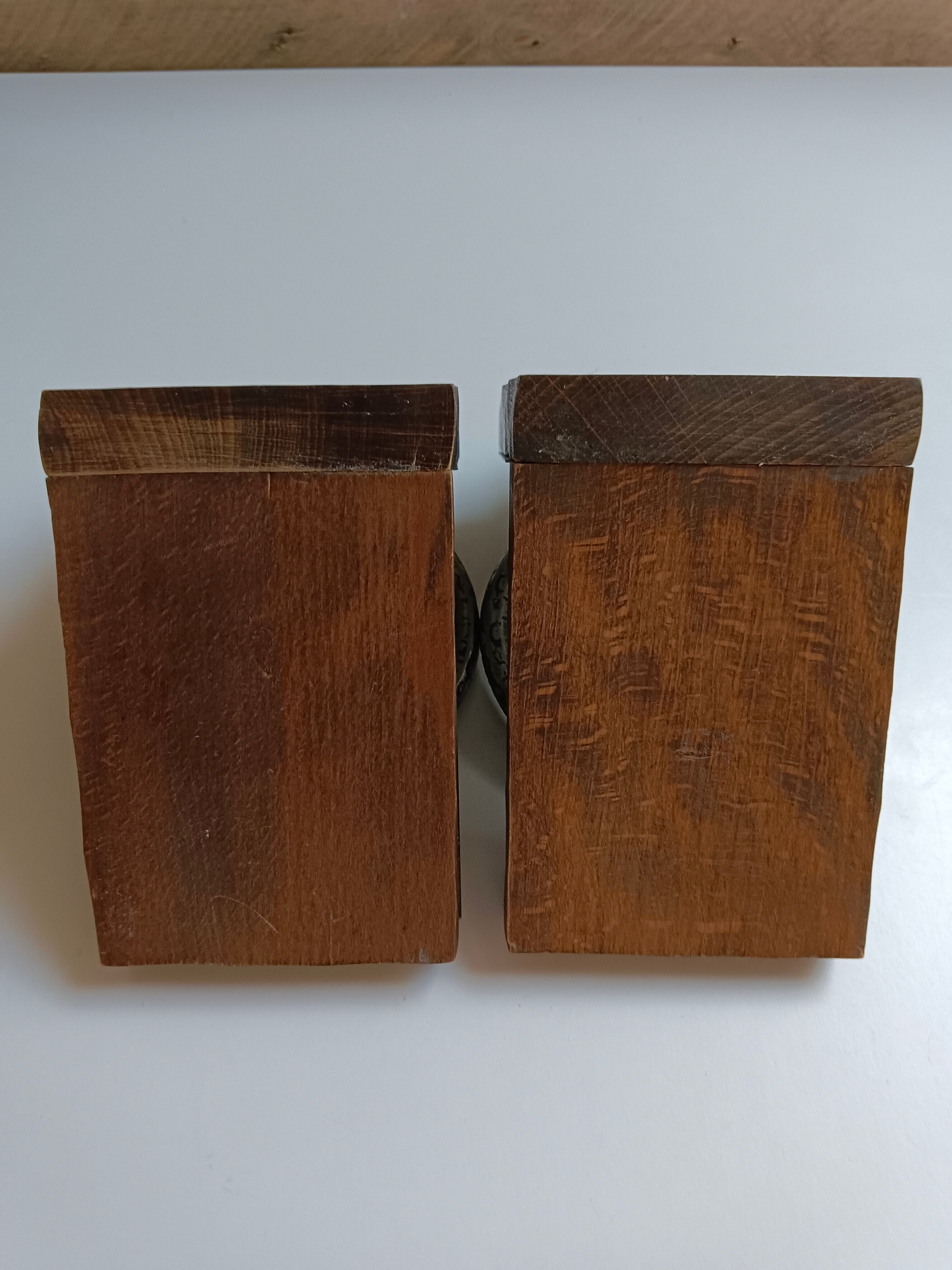 Medieval-style bookends, antique door handle.
