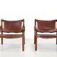 Deux fauteuils Arne Norell Sirocco en palissandre et cuir.