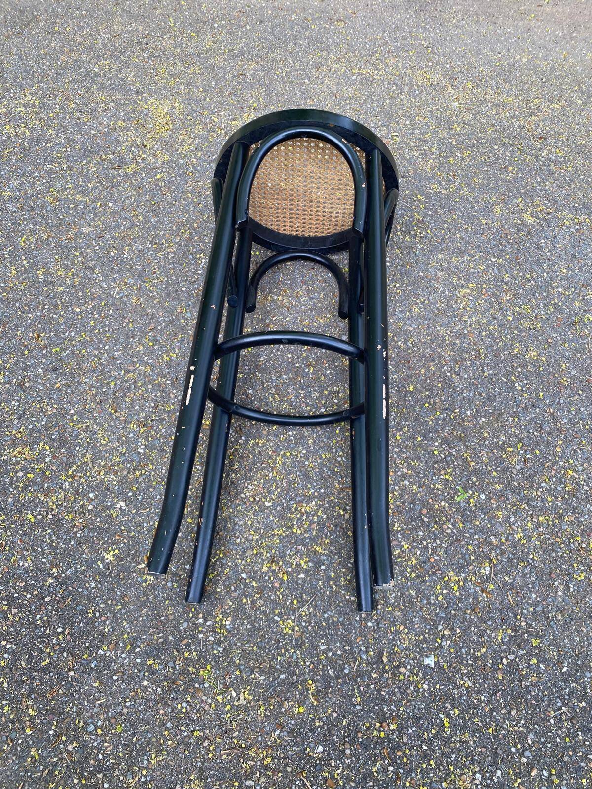High curved black caned wooden bistro bar stool